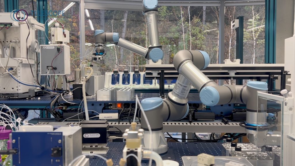 A robotic arm in a British Columbia lab manages vials on advanced equipment, highlighting innovation and technology infrastructure in Canada.