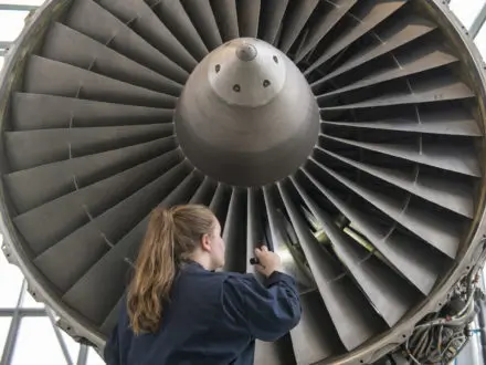 BCIT student working on aerospace equipment.