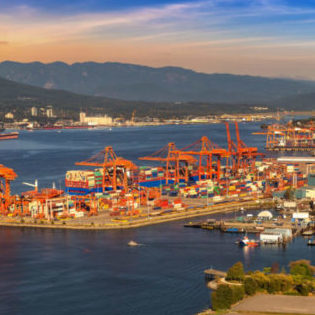 Panoramic aerial view of Vancouver Centerm Terminal - Container port terminal at sunset, Canada