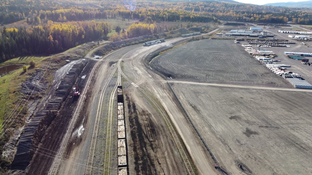 Birds eye view of rail tracks and containers being stored in rural BC