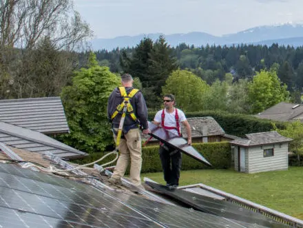 Hakai Energy Solutions workers installing clean energy infrastructure.