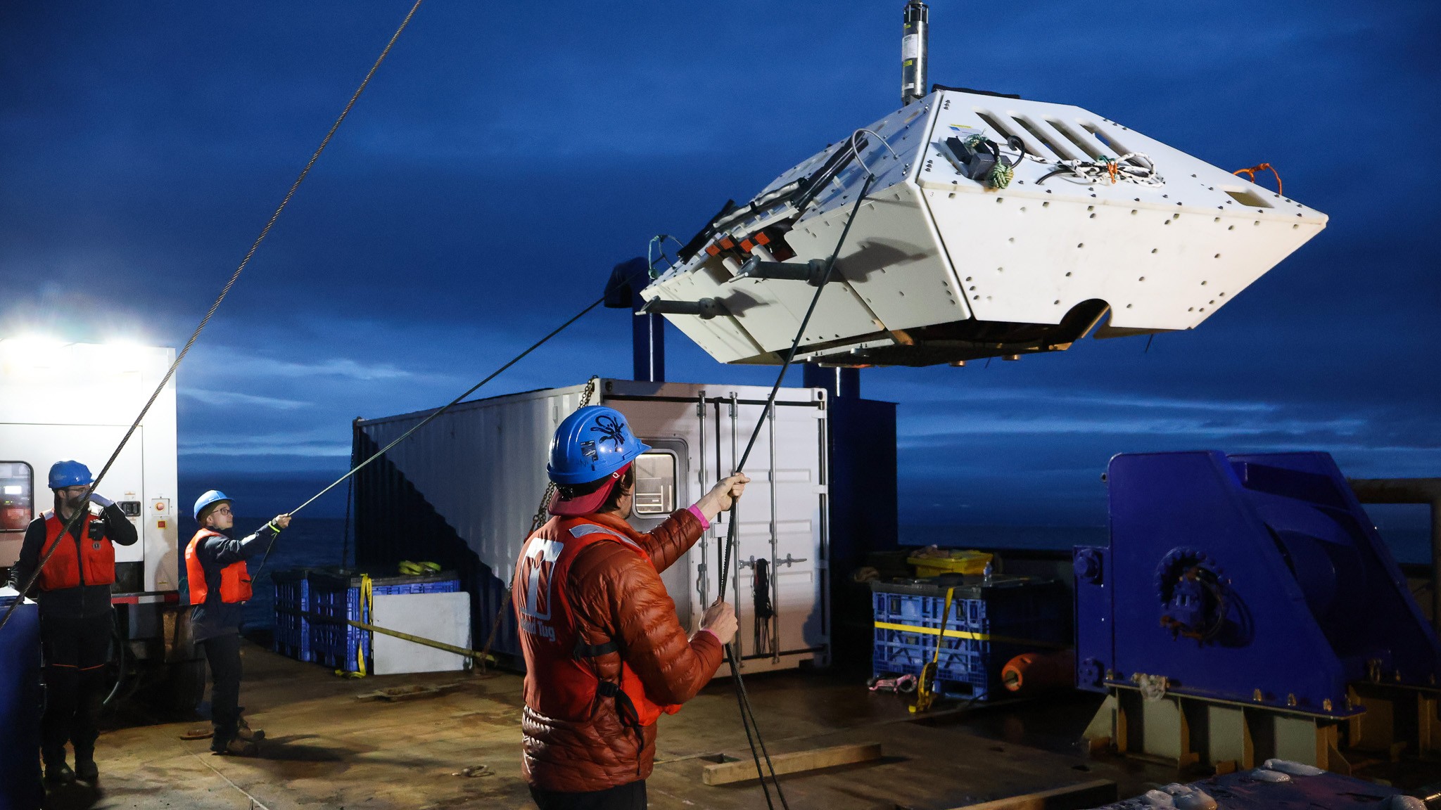 ONC staff deploys a node in Strait of Georgia to supply power and internet connectivity to the underwater instruments of the VENUS observatory.