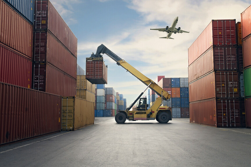 Image of a logistics or shipping scene with a plane flying over stacked shipping containers, highlighting global trade and transportation.