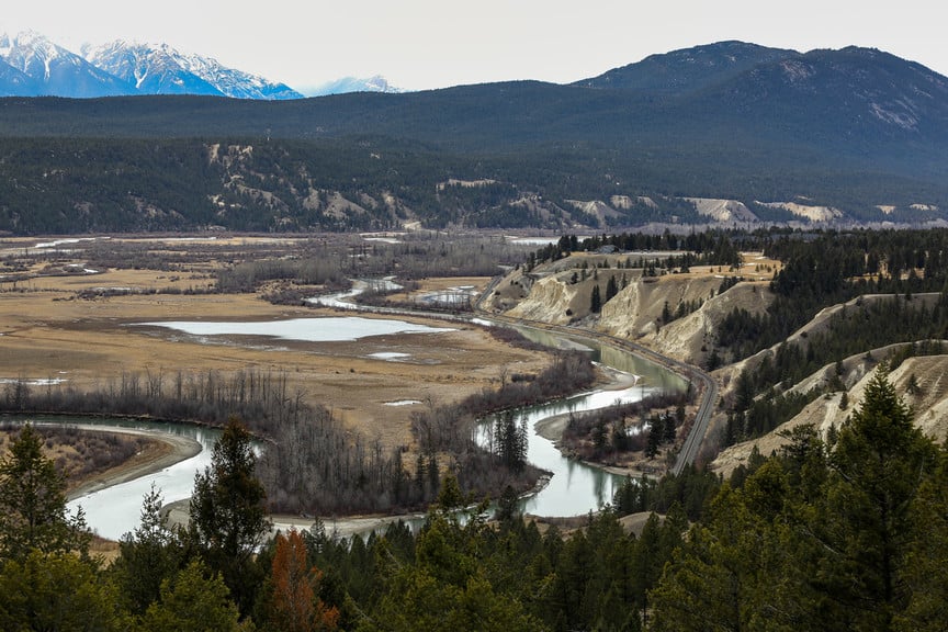 Rail line curves its way through the valley along the Kootenay River, Cranbrook. Cranbrook is historically and currently known for its rich natural resource economy, particularly forestry and mining.