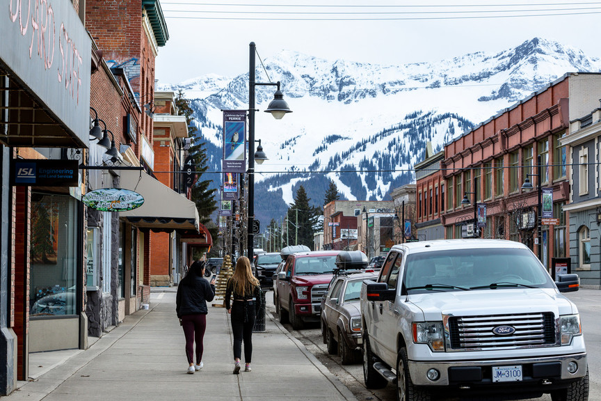 The historic downtown of Fernie, a city located in the Kootenay region, with snow capped mountains.