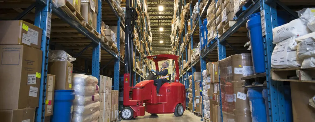 Forklift in Warehouse Aisle