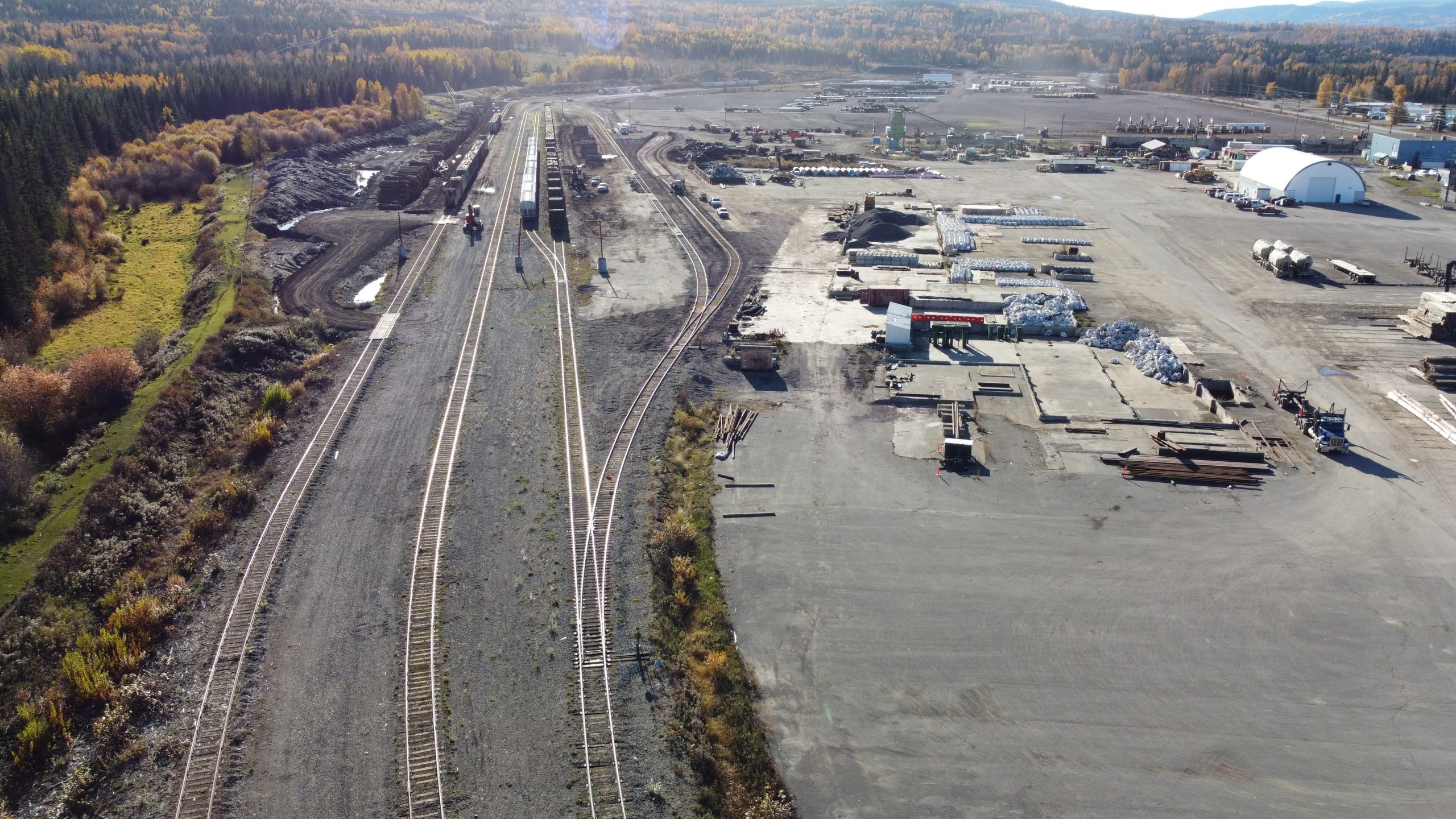 Birds eye view of rail tracks and containers being stored in rural BC