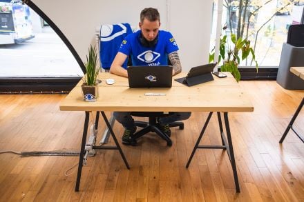 VSHN tech worker seated at desk