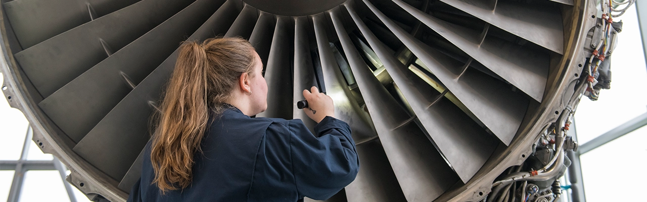 BCIT student working on aerospace equipment.