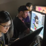 Digital Media Employees Working on Computers