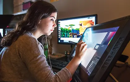 Employee at touch screen workstation