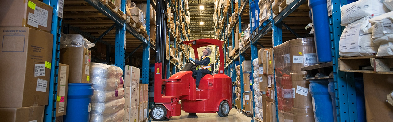 Forklift in Warehouse Aisle