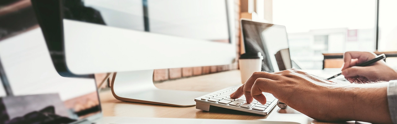 Doing Business in BC - hands typing on keyboard.